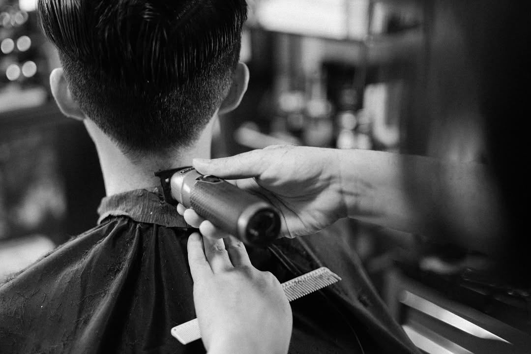 Men's fade haircut with clean neckline